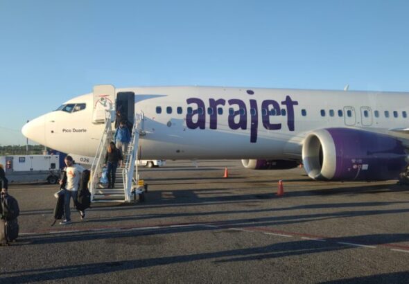 people-disembarking-from-an-arajet-boeing-737-max-8-aircraft-in-santo-domingo-860x484